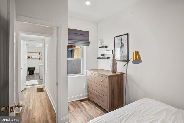 bedroom with light wood-type flooring