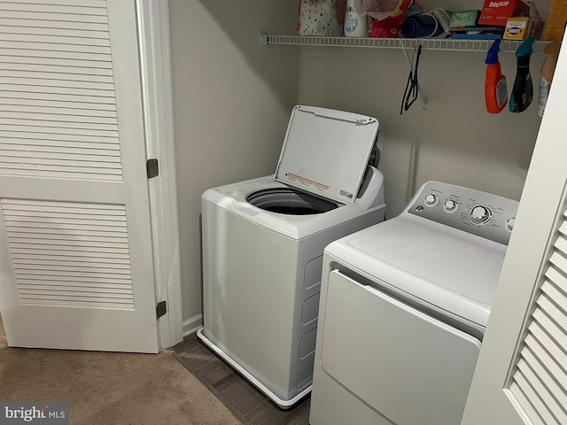 clothes washing area with carpet flooring and washing machine and dryer