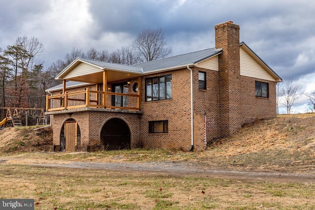 2520 Ridge Rd, Upper Tract, WV 26866 - back of property featuring brick siding, a chimney, and a metal roof