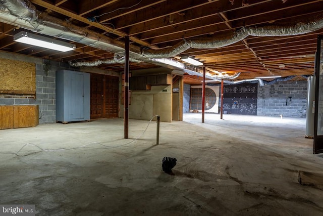 2520 Ridge Rd, Upper Tract, WV 26866 - unfinished basement featuring water heater and concrete block wall