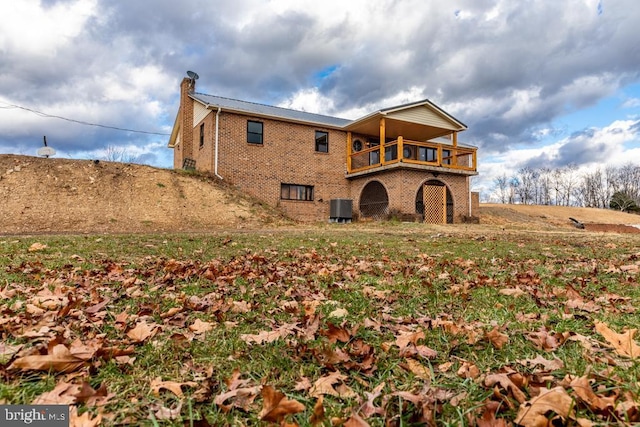 2520 Ridge Rd, Upper Tract, WV 26866 - back of house featuring a balcony, a chimney, and brick siding