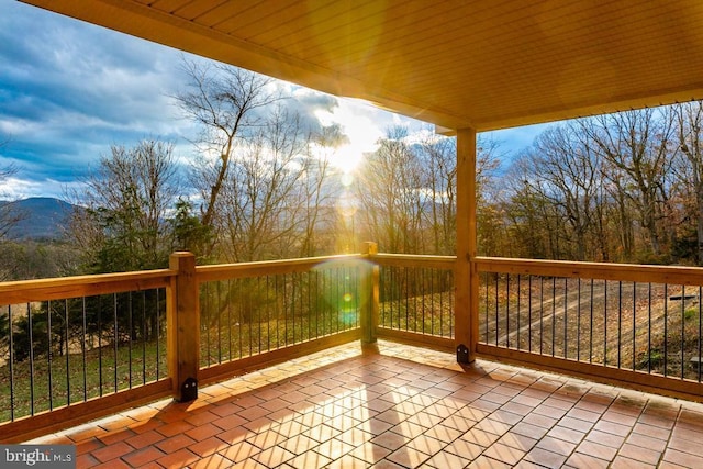 wooden deck with a mountain view