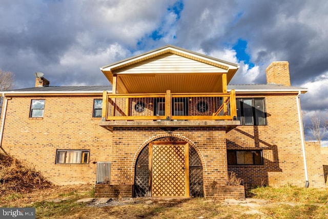 back of house with a balcony