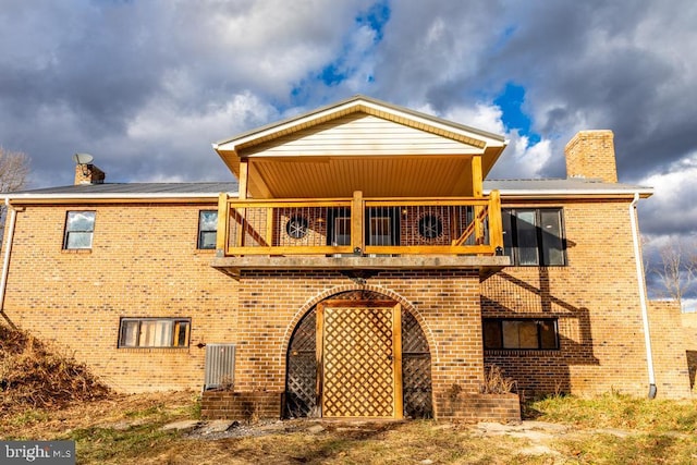 2520 Ridge Rd, Upper Tract, WV 26866 - back of property featuring a chimney, a balcony, and brick siding