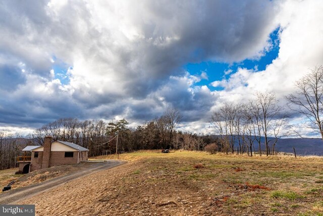 view of yard with a rural view