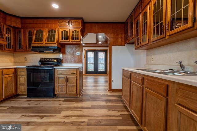 2520 Ridge Rd, Upper Tract, WV 26866 - kitchen featuring black range with electric cooktop, under cabinet range hood, light wood-style flooring, glass insert cabinets, and recessed lighting