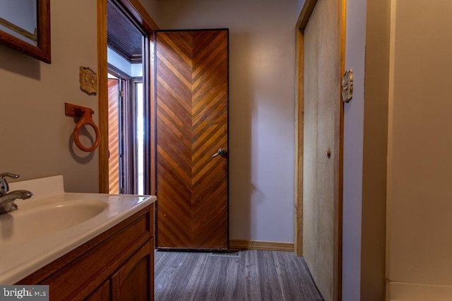 bathroom featuring vanity and hardwood / wood-style flooring