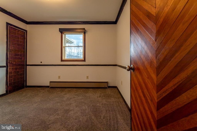 carpeted empty room with wood walls, a baseboard radiator, and ornamental molding