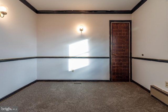 carpeted spare room featuring ornamental molding and a baseboard heating unit