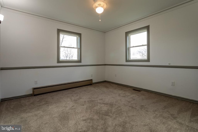 carpeted empty room with ornamental molding and a baseboard radiator