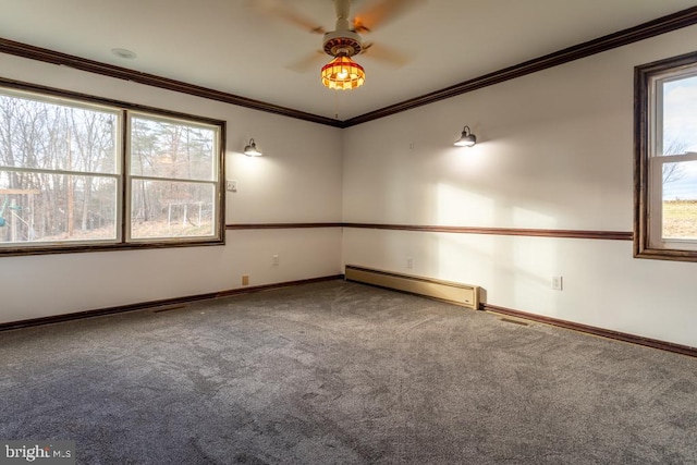 spare room with carpet flooring, ceiling fan, ornamental molding, and a baseboard heating unit