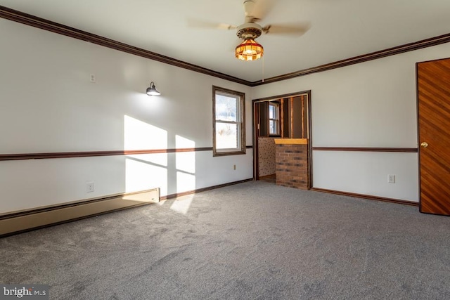 carpeted empty room featuring a baseboard radiator, ceiling fan, and crown molding