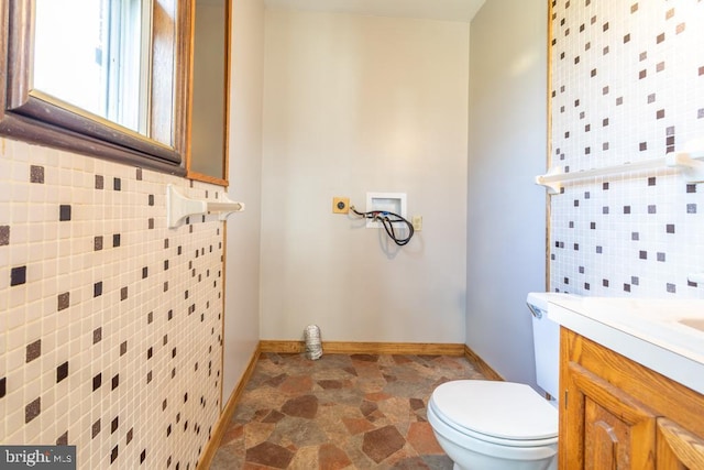 2520 Ridge Rd, Upper Tract, WV 26866 - bathroom featuring tile walls, vanity, and stone finish floors