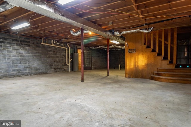 2520 Ridge Rd, Upper Tract, WV 26866 - unfinished basement with stairway and water heater