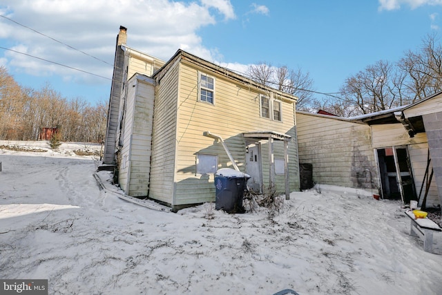 view of snow covered house