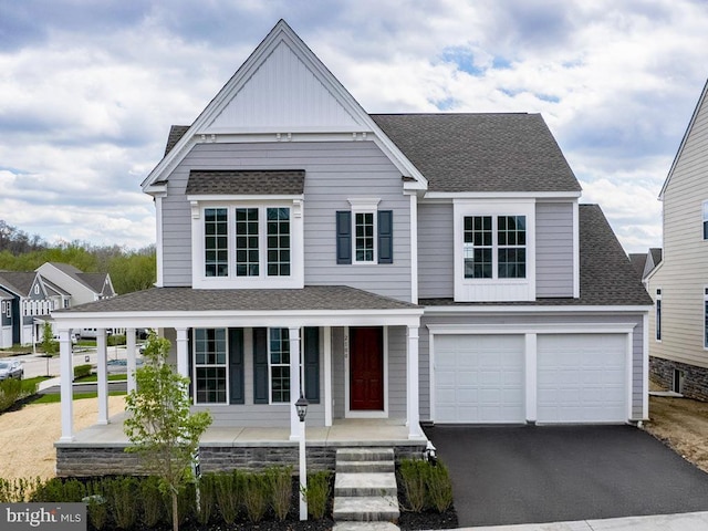 view of front facade featuring a garage and a porch