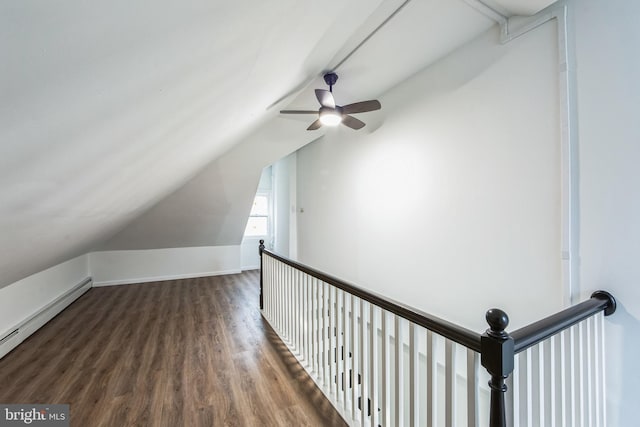 bonus room with a baseboard radiator, vaulted ceiling, ceiling fan, and dark wood-type flooring