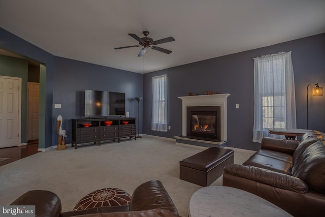 living room featuring ceiling fan and carpet floors