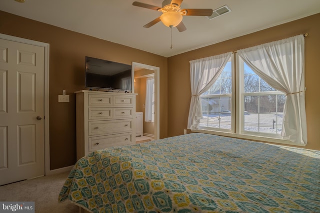 unfurnished bedroom featuring multiple windows, light carpet, and ceiling fan