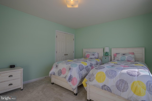 carpeted bedroom featuring a closet