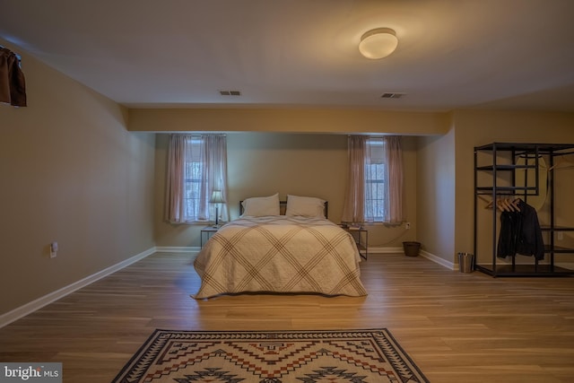 bedroom with wood-type flooring