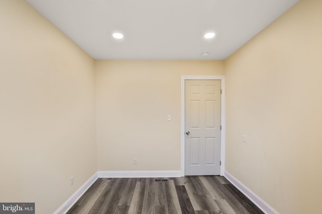 empty room featuring dark hardwood / wood-style floors