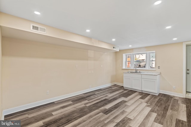 interior space with dark hardwood / wood-style floors and sink