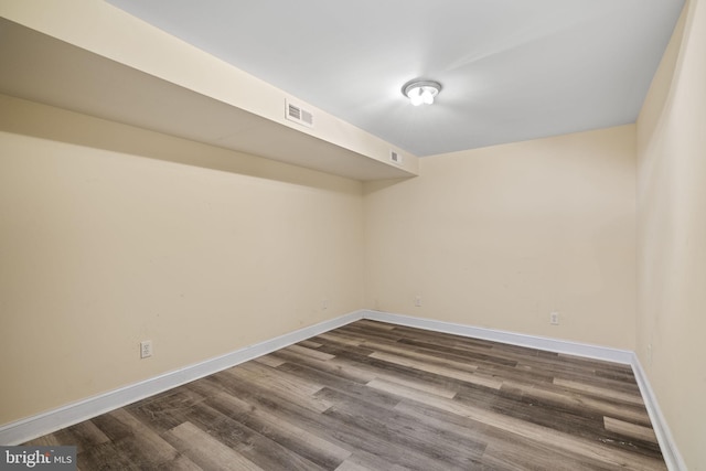 empty room featuring dark hardwood / wood-style floors