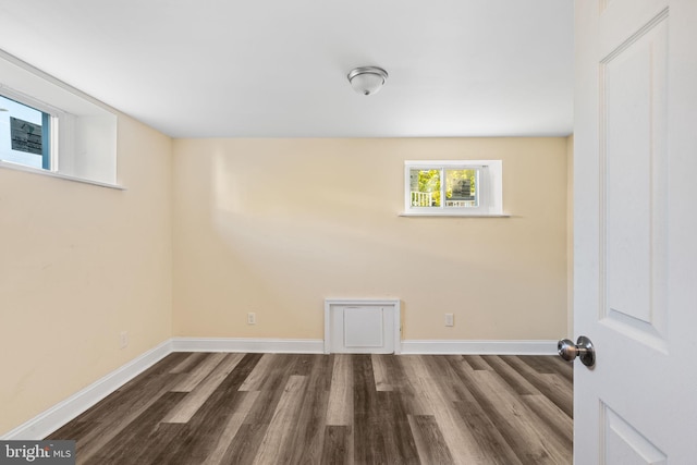 basement with dark wood-type flooring