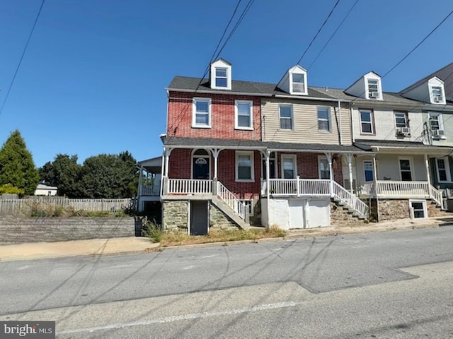 view of property featuring covered porch