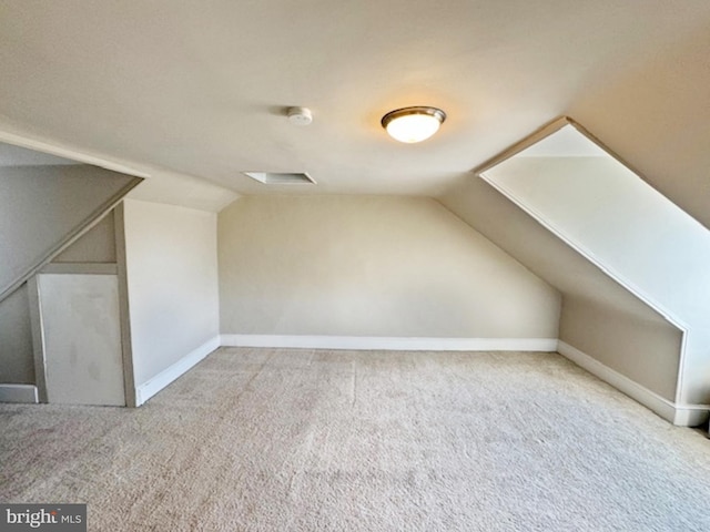 bonus room featuring carpet floors and lofted ceiling