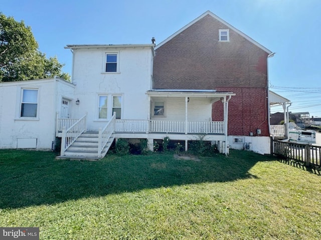 back of house with a yard