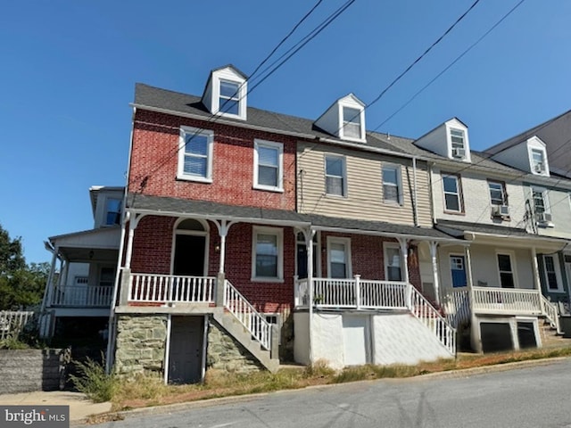 view of property featuring a porch