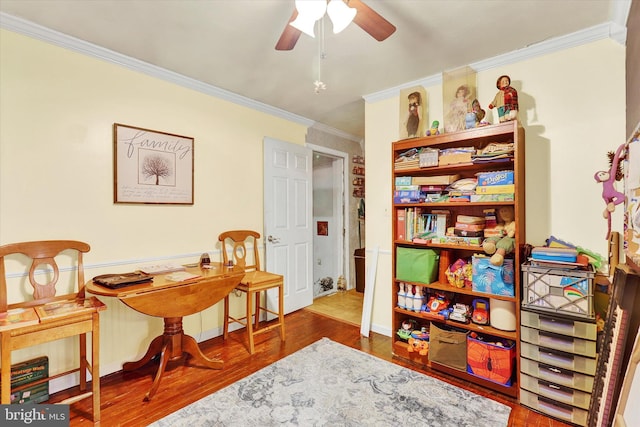 sitting room featuring crown molding, hardwood / wood-style floors, and ceiling fan