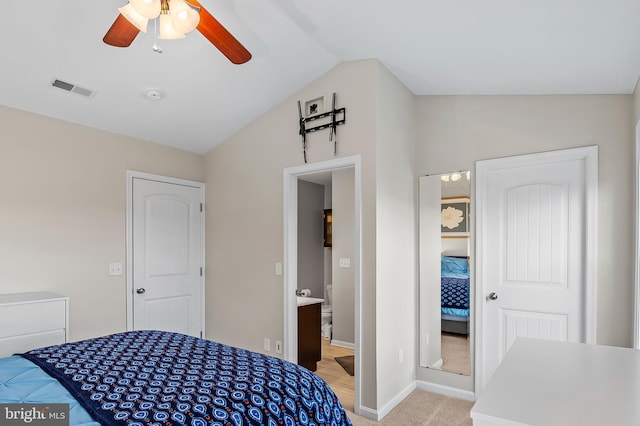 carpeted bedroom with ceiling fan and lofted ceiling