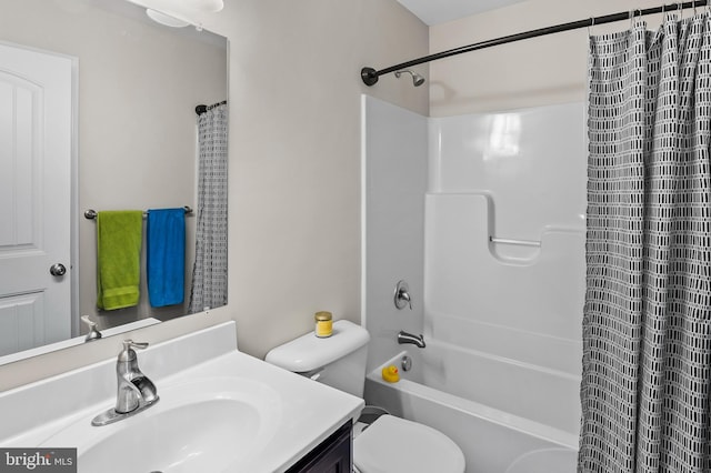 full bathroom with vanity, shower / bath combo, and toilet