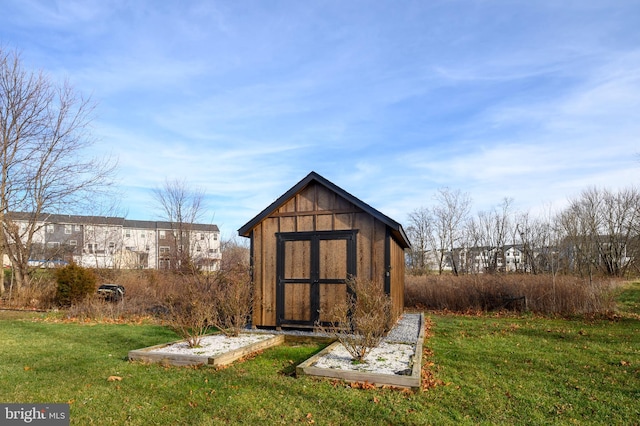 view of outdoor structure featuring a lawn