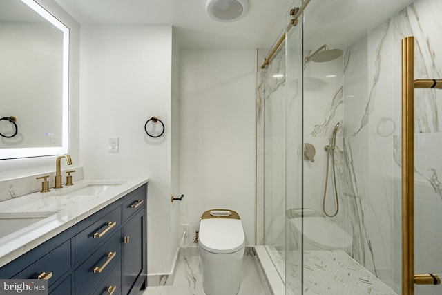 bathroom featuring vanity, toilet, and a shower with door