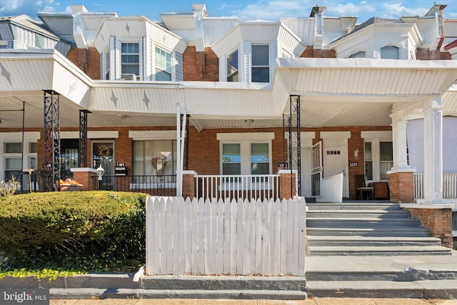 view of property with a porch