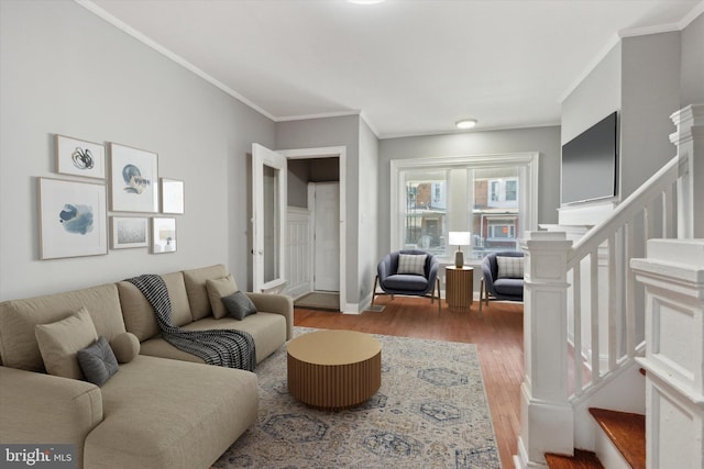 living room featuring hardwood / wood-style floors and ornamental molding