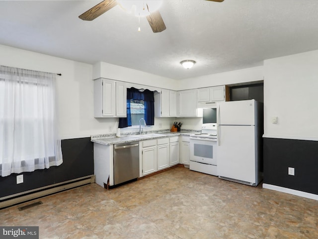 kitchen with white appliances, a baseboard heating unit, sink, ceiling fan, and white cabinetry