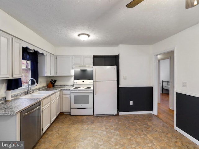 kitchen featuring ceiling fan, sink, a textured ceiling, white appliances, and white cabinets