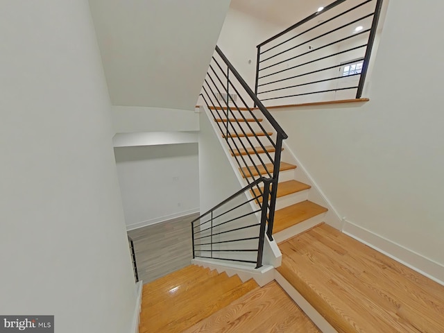 stairway with wood-type flooring