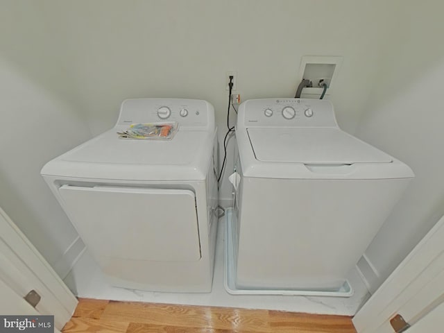 clothes washing area with washer and dryer