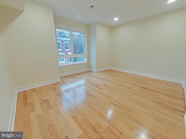 spare room featuring light hardwood / wood-style floors