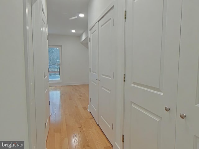 corridor featuring light hardwood / wood-style floors