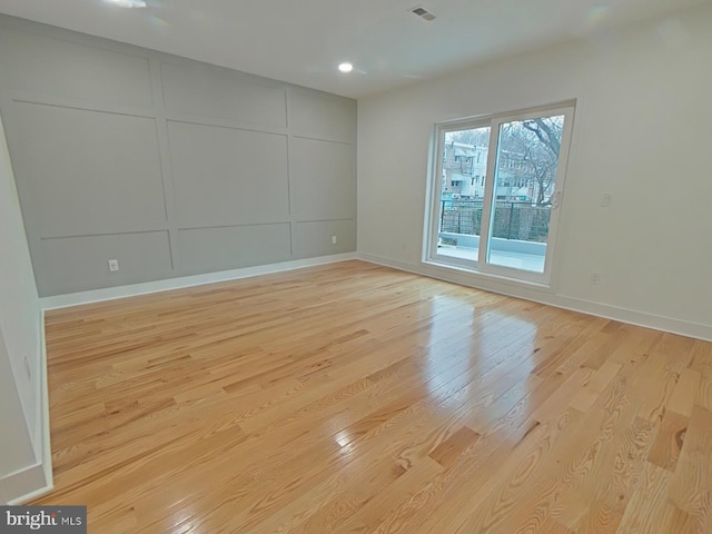 unfurnished room featuring light hardwood / wood-style floors