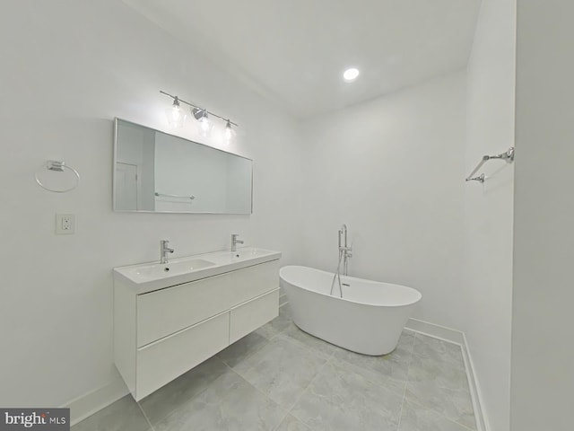 bathroom featuring a bathing tub and vanity