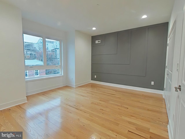 empty room with light wood-type flooring