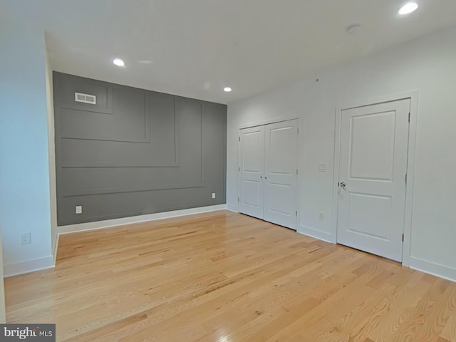 unfurnished bedroom with light hardwood / wood-style flooring